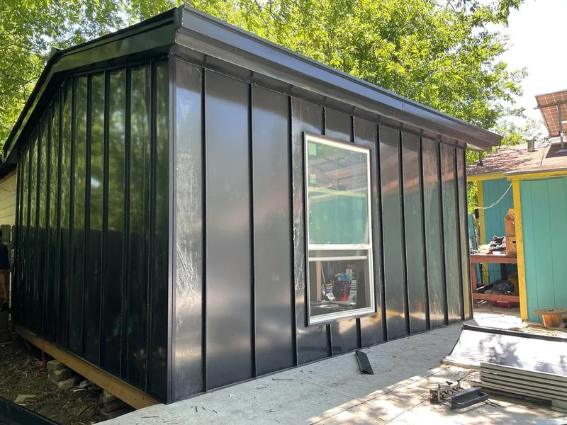 Black standing seam metal wall panels for Roof Inspection in Janesville