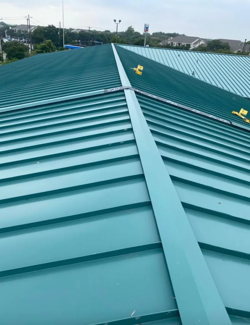 Green commercial metal roof ridge and valley for Metal Roof Repair in Janesville